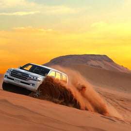 Dubaj: Safari po pustyni z czerwonymi wydmami, quadami, wielbłądami i grillem